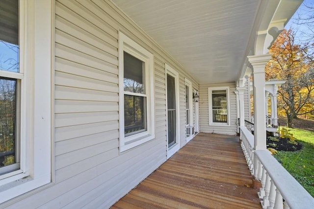 wooden deck featuring covered porch