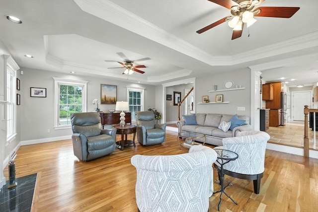 11 Rachael Ter, Westfield, MA 01085 - living area with a raised ceiling, a ceiling fan, light wood-style floors, stairway, and crown molding
