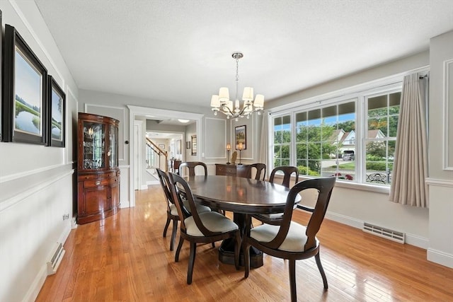 11 Rachael Ter, Westfield, MA 01085 - dining room featuring a chandelier, light wood-style floors, and stairway