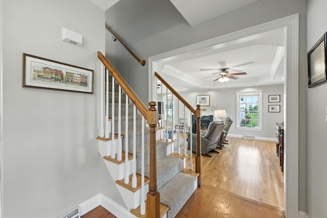 11 Rachael Ter, Westfield, MA 01085 - staircase with a raised ceiling, wood finished floors, ceiling fan, baseboard heating, and crown molding