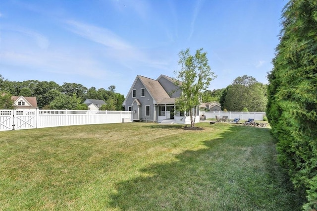 11 Rachael Ter, Westfield, MA 01085 - back of property with a fenced backyard and a sunroom
