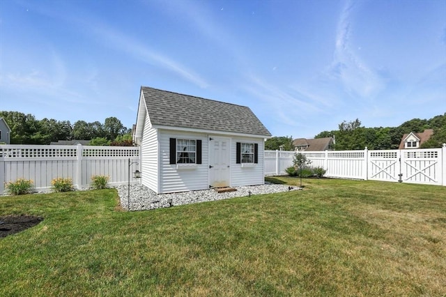 11 Rachael Ter, Westfield, MA 01085 - back of house with a fenced backyard, roof with shingles, and an outdoor structure