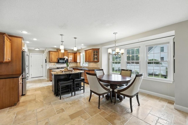 11 Rachael Ter, Westfield, MA 01085 - dining space featuring stone tile floors, recessed lighting, a textured ceiling, and a chandelier