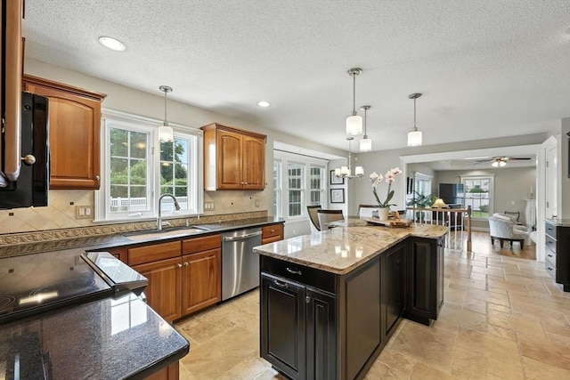 11 Rachael Ter, Westfield, MA 01085 - kitchen with stainless steel dishwasher, a kitchen island, backsplash, dark stone countertops, and a textured ceiling