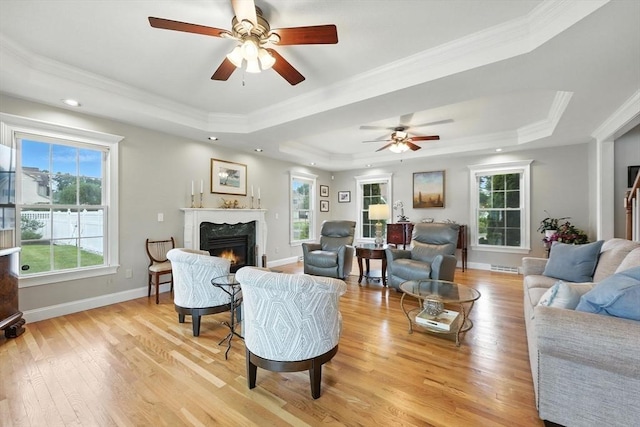 11 Rachael Ter, Westfield, MA 01085 - living room featuring a tray ceiling, a high end fireplace, a ceiling fan, crown molding, and recessed lighting