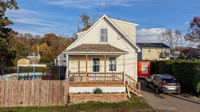 view of property featuring covered porch