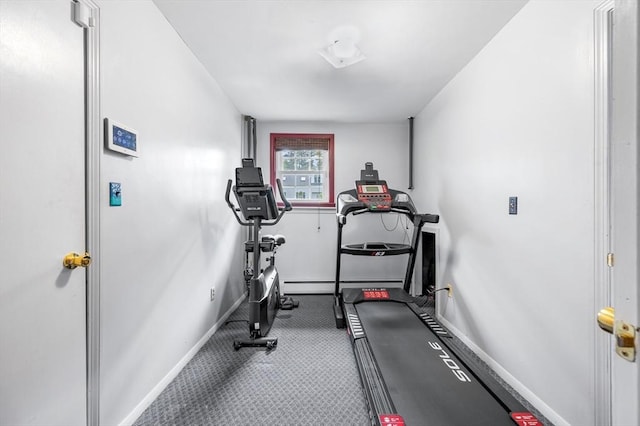 workout area with baseboards and a baseboard heating unit