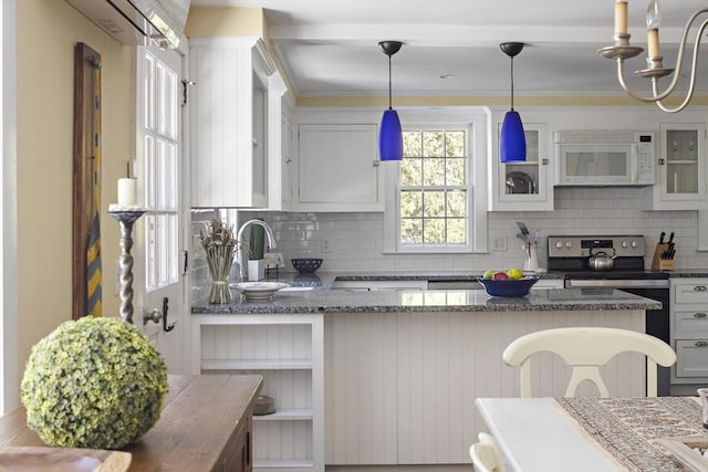 8 School House Vlg, Oak Bluffs, MA 02557 - kitchen featuring white microwave, tasteful backsplash, stainless steel electric stove, glass insert cabinets, and dark stone countertops
