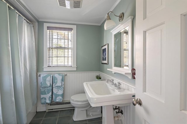 8 School House Vlg, Oak Bluffs, MA 02557 - bathroom featuring a baseboard radiator, toilet, wainscoting, tile patterned floors, and ornamental molding