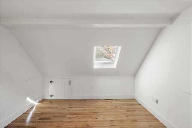 8 School House Vlg, Oak Bluffs, MA 02557 - bonus room featuring a skylight, vaulted ceiling, baseboards, and light wood-style flooring