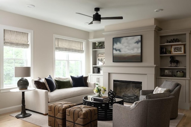 91 Miter Dr Unit 2-2, Plymouth, MA 02360 - living room featuring baseboards, ceiling fan, wood finished floors, and a glass covered fireplace