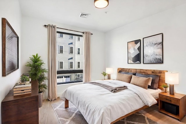 bedroom with light hardwood / wood-style floors