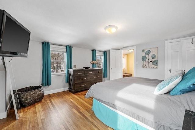 bedroom with light hardwood / wood-style floors