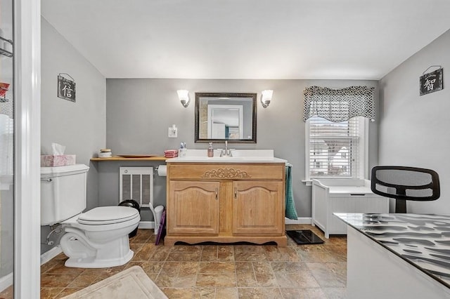 bathroom featuring toilet and vanity