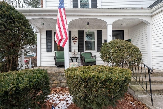 view of exterior entry featuring a porch