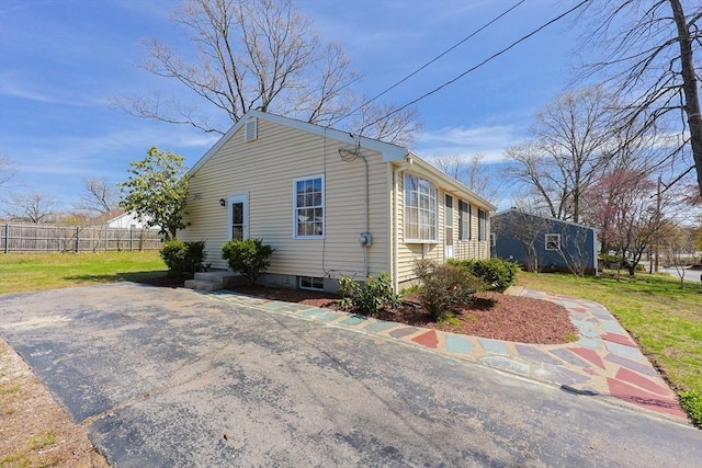 view of property exterior featuring fence
