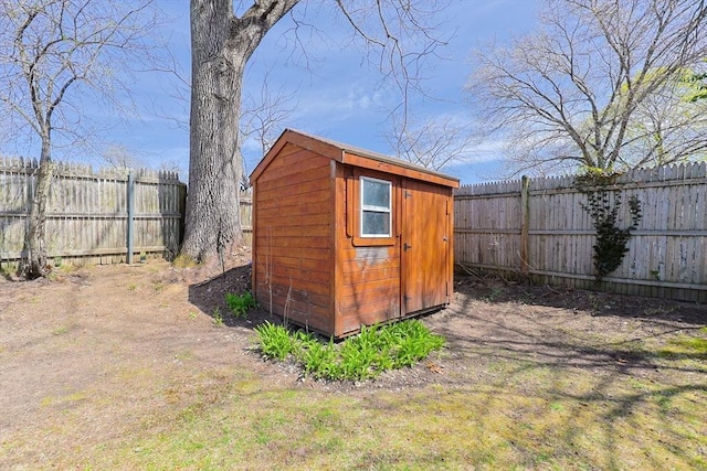 view of shed featuring a fenced backyard