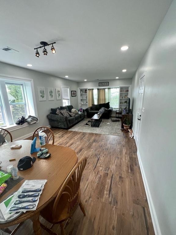 dining space with hardwood / wood-style flooring