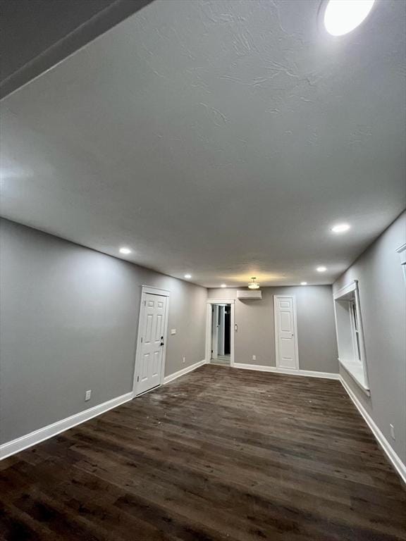 basement with dark wood-type flooring