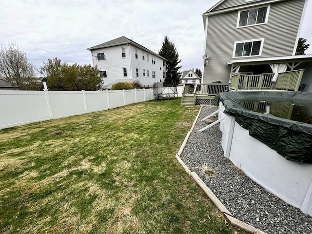 view of yard featuring a wooden deck