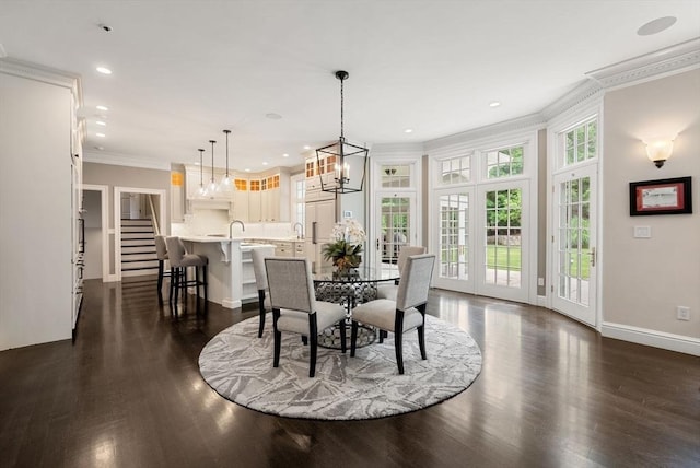 43 Bristol Rd, Wellesley, MA 02481 - dining area featuring crown molding, dark wood finished floors, a chandelier, recessed lighting, and stairway