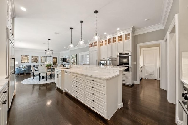 43 Bristol Rd, Wellesley, MA 02481 - kitchen featuring dark wood-style floors, an island with sink, white cabinets, glass insert cabinets, and stainless steel double oven