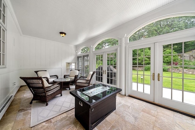 43 Bristol Rd, Wellesley, MA 02481 - living room with french doors, stone tile floors, baseboard heating, and crown molding