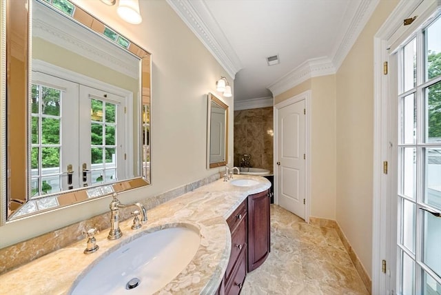 43 Bristol Rd, Wellesley, MA 02481 - full bathroom featuring healthy amount of natural light, double vanity, crown molding, and french doors