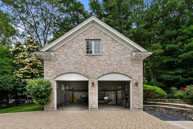 43 Bristol Rd, Wellesley, MA 02481 - garage featuring decorative driveway