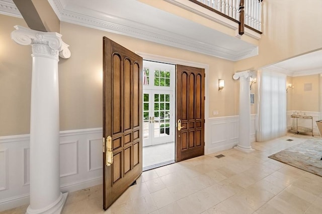 43 Bristol Rd, Wellesley, MA 02481 - entrance foyer with a decorative wall, decorative columns, wainscoting, and ornamental molding