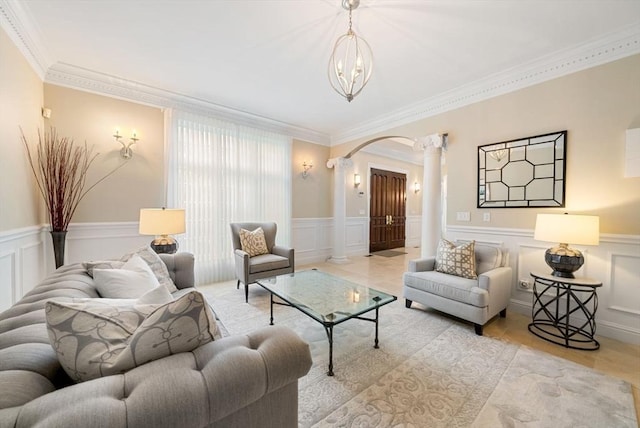 43 Bristol Rd, Wellesley, MA 02481 - living room featuring ornate columns, arched walkways, a decorative wall, a wainscoted wall, and ornamental molding
