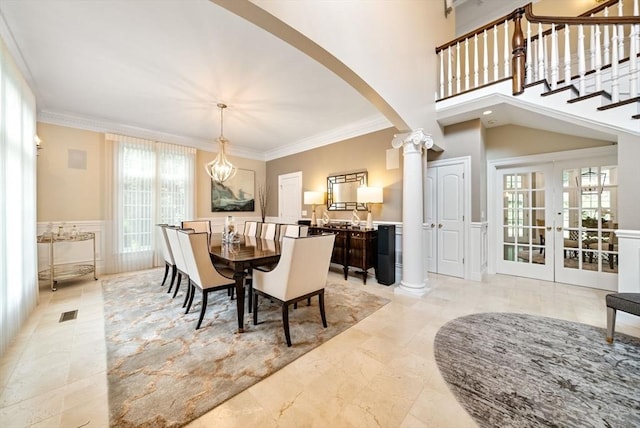 43 Bristol Rd, Wellesley, MA 02481 - dining area featuring ornate columns, arched walkways, ornamental molding, and french doors