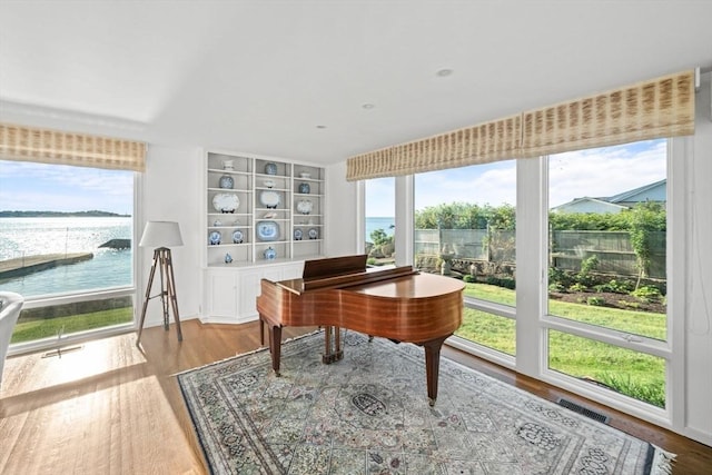 124 William St, Dartmouth, MA 02748 - office space featuring plenty of natural light, a water view, and wood finished floors