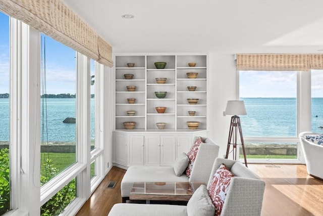 124 William St, Dartmouth, MA 02748 - sitting room with a water view, dark wood finished floors, and plenty of natural light