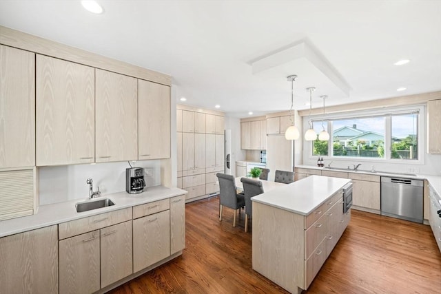 124 William St, Dartmouth, MA 02748 - kitchen with stainless steel dishwasher, a sink, a kitchen island, light countertops, and recessed lighting