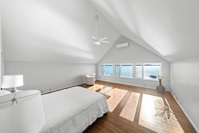 124 William St, Dartmouth, MA 02748 - bedroom featuring wood finished floors, lofted ceiling, baseboards, ceiling fan, and a wall unit AC