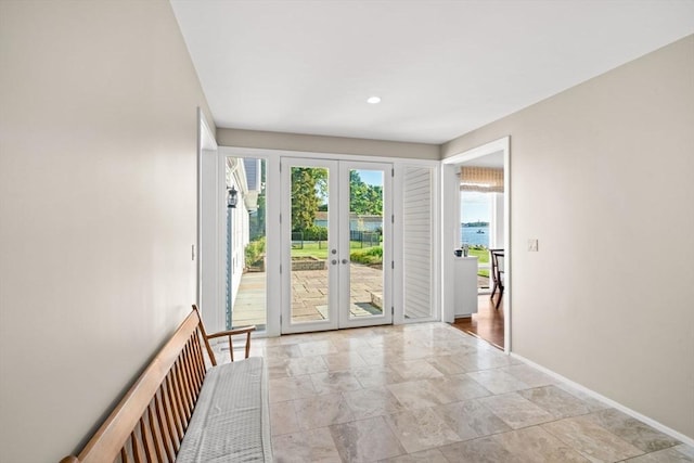 124 William St, Dartmouth, MA 02748 - doorway with french doors, baseboards, light stone finish flooring, and recessed lighting