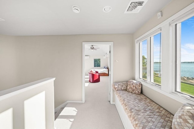 124 William St, Dartmouth, MA 02748 - hallway featuring a water view, light carpet, and baseboards