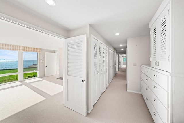 124 William St, Dartmouth, MA 02748 - hallway featuring light carpet, recessed lighting, a water view, and baseboards
