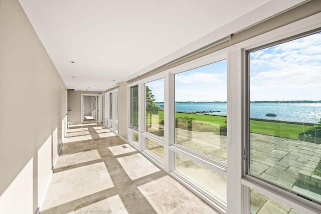 124 William St, Dartmouth, MA 02748 - corridor featuring a water view, baseboards, and stone finish floors