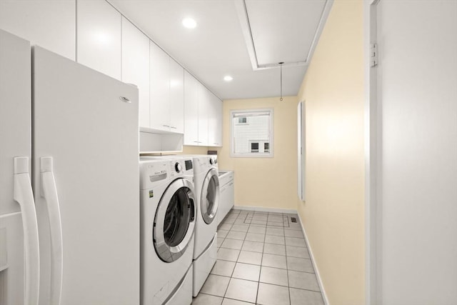 124 William St, Dartmouth, MA 02748 - washroom featuring attic access, independent washer and dryer, cabinet space, baseboards, and light tile patterned flooring