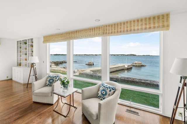 124 William St, Dartmouth, MA 02748 - sitting room featuring plenty of natural light, a water view, and wood finished floors
