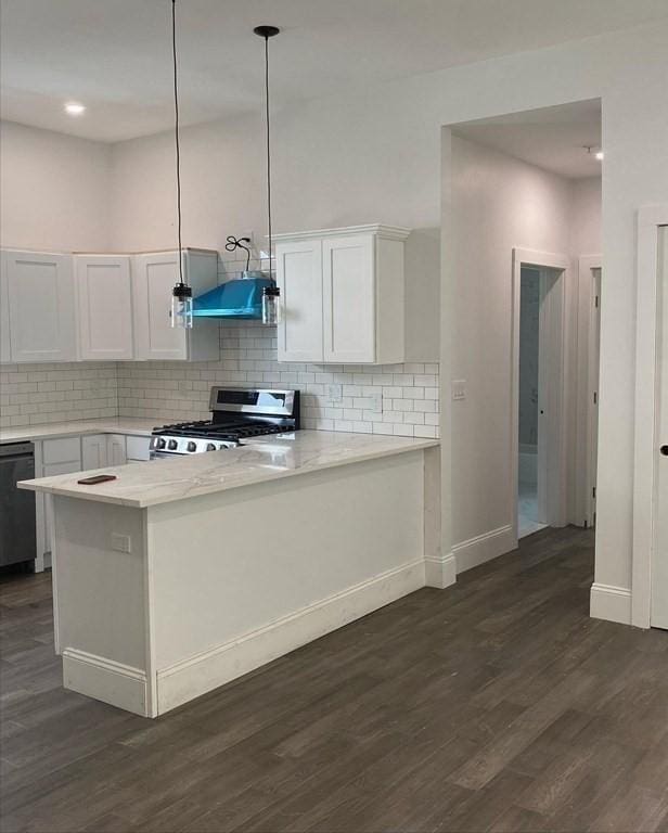 kitchen with white cabinets, black dishwasher, dark wood-type flooring, and stainless steel range with gas stovetop