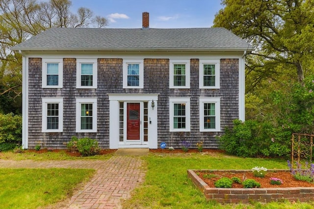 68 Pleasant St, Chatham, MA 02659 - colonial home with a chimney, a front yard, and roof with shingles