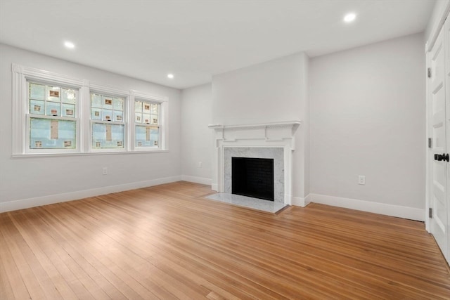 unfurnished living room with light hardwood / wood-style floors