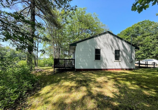 5 Maguire Rd, Ashburnham, MA 01430 - view of home's exterior with a wooden deck and a yard