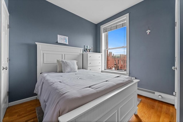 483 Beacon Unit 63, Boston, MA 02115 - bedroom featuring wood finished floors and baseboard heating