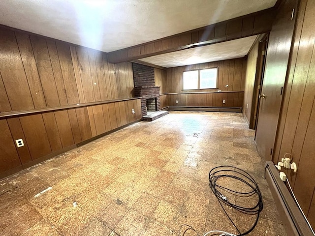 31 Dix Rd, Woburn, MA 01801 - basement featuring a baseboard radiator, wood walls, tile patterned floors, a brick fireplace, and baseboard heating