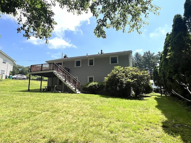 31 Dix Rd, Woburn, MA 01801 - rear view of house with stairs, a deck, and a yard