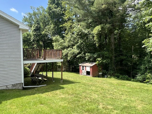 31 Dix Rd, Woburn, MA 01801 - view of grassy yard featuring a storage shed, stairway, and a wooden deck